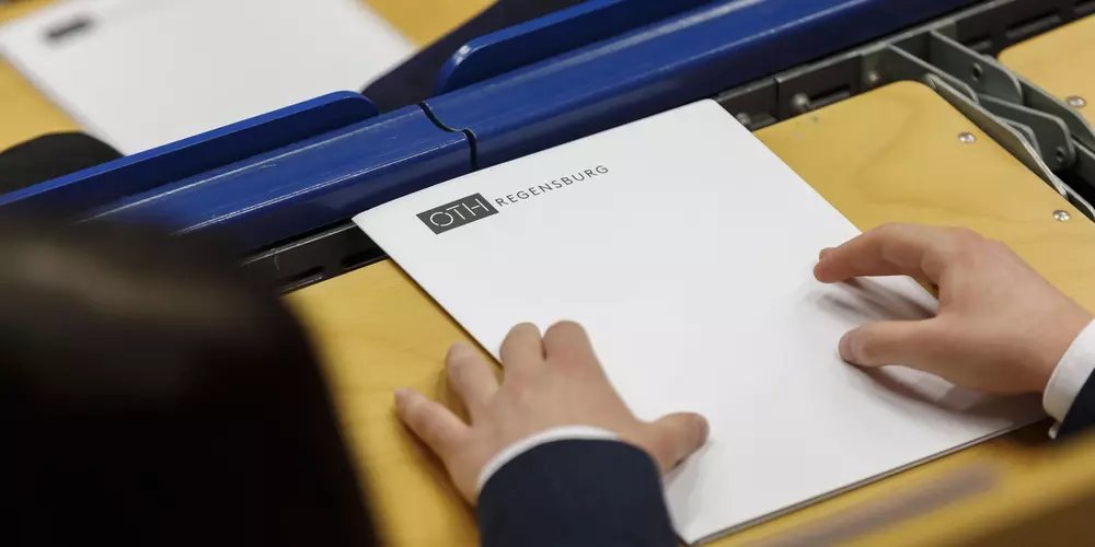 Two hands lying on a document